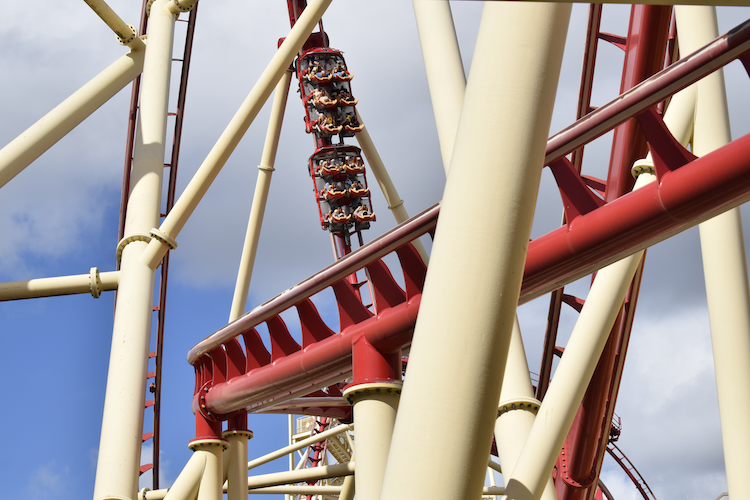 Hollywood Rip Ride Rockit roller coaster against a bright blue sky, capturing the thrill of amusement park rides.